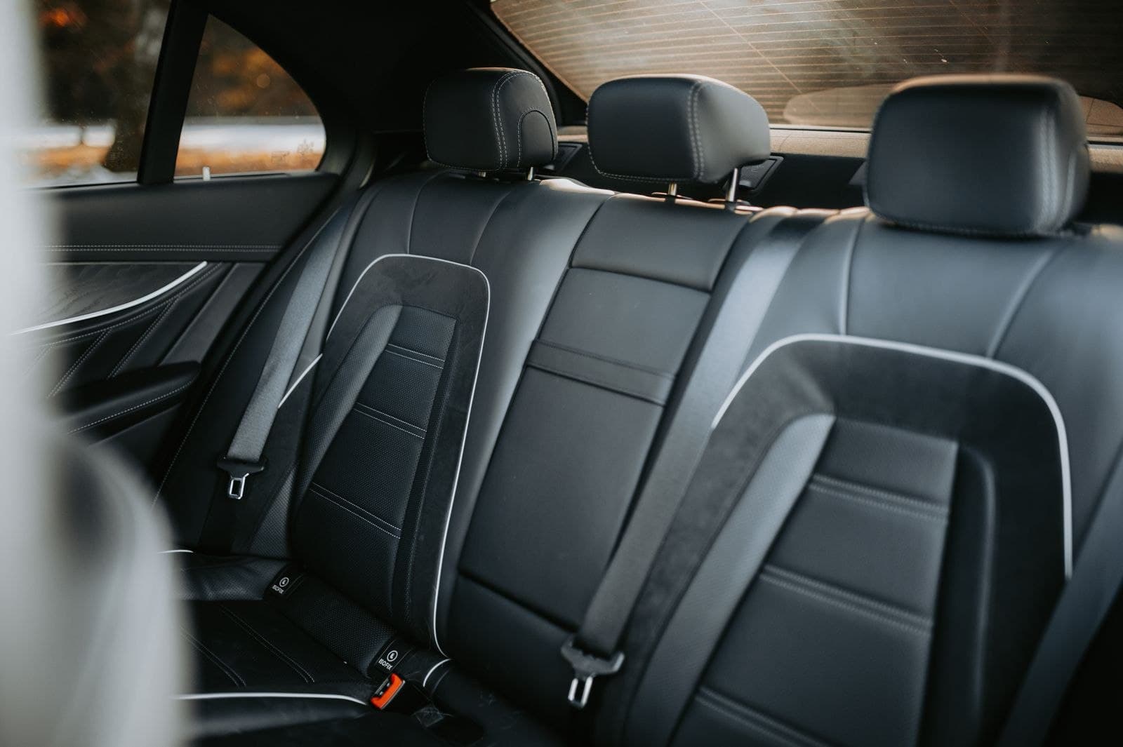 Black leather rear passenger cabin of a luxury sedan